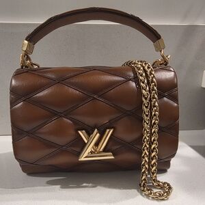 Louis Vuitton GO-14 MM bag in quilted lambskin leather with a toasted finish. 